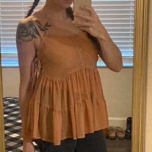 Light pink tank top, ruffles, corset sides